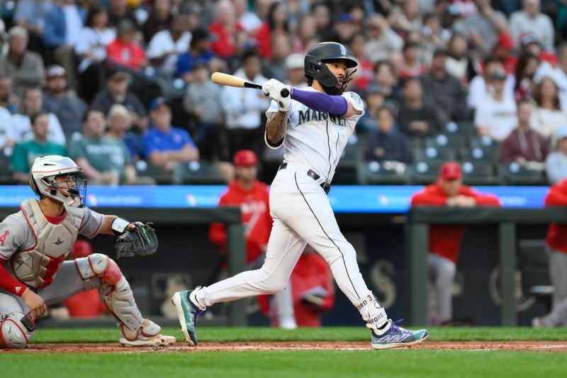 Sep 11, 2023; Seattle, Washington, USA; Seattle Mariners shortstop J.P. Crawford (3) hits a single against the Los Angeles Angels during the first inning at T-Mobile Park. Mandatory Credit: Steven Bisig-USA TODAY Sports