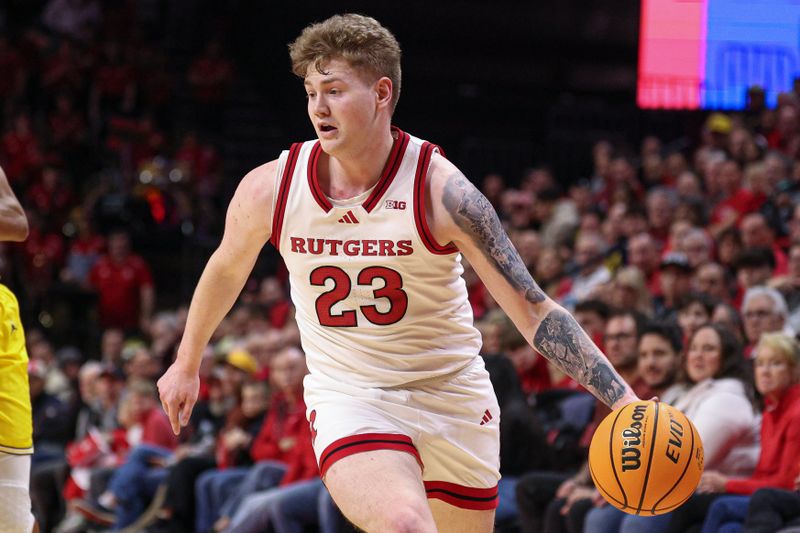 Feb 1, 2025; Piscataway, New Jersey, USA; Rutgers Scarlet Knights guard PJ Hayes IV (23) dribbles up court during the second half against the Michigan Wolverines at Jersey Mike's Arena. Mandatory Credit: Vincent Carchietta-Imagn Images