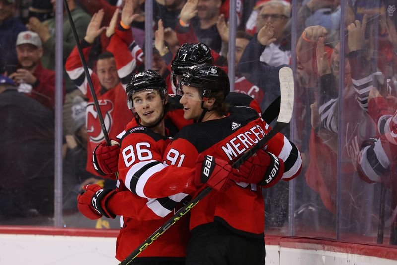 Feb 23, 2023; Newark, New Jersey, USA; New Jersey Devils center Dawson Mercer (91) celebrates his game winning goal against the Los Angeles Kings during overtime at Prudential Center. Mandatory Credit: Ed Mulholland-USA TODAY Sports