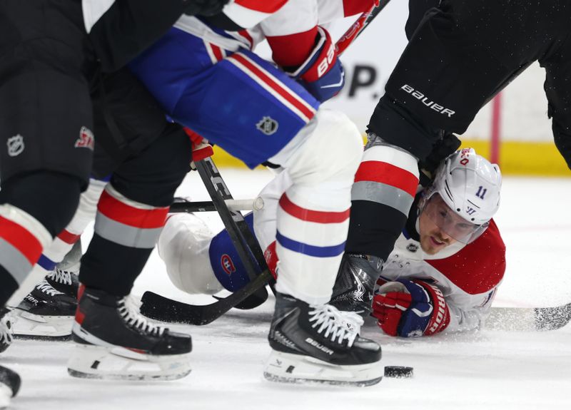 Jan 15, 2026; Buffalo, New York, USA;  Montréal Canadiens right wing Brendan Gallagher (11) falls and looks for the puck during the third period against the Montréal Canadiens at KeyBank Center. Mandatory Credit: Timothy T. Ludwig-Imagn Images