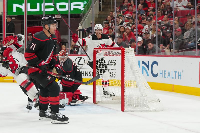 Oct 9, 2025; Raleigh, North Carolina, USA;  New Jersey Devils defenseman Dougie Hamilton (7) celebrates his goal against the Carolina Hurricanes during the second period at Lenovo Center. Mandatory Credit: James Guillory-Imagn Images