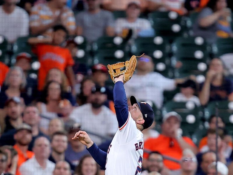 Jun 26, 2024; Houston, Texas, USA; Houston Astros third baseman Alex Bregman (2) catches a fly ball for an out against the Colorado Rockies during the fourth inning at Minute Maid Park. Mandatory Credit: Erik Williams-USA TODAY Sports