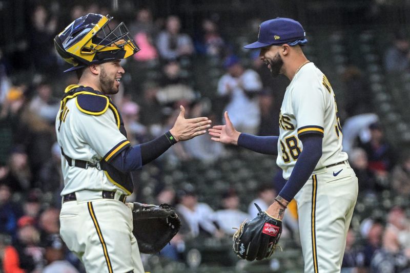 Apr 26, 2023; Milwaukee, Wisconsin, USA; Milwaukee Brewers pitcher Devin Williams (38) celebrates with catcher Victor Caratini (7) after the Brewers beat the Detroit Tigers at American Family Field. Mandatory Credit: Benny Sieu-USA TODAY Sports