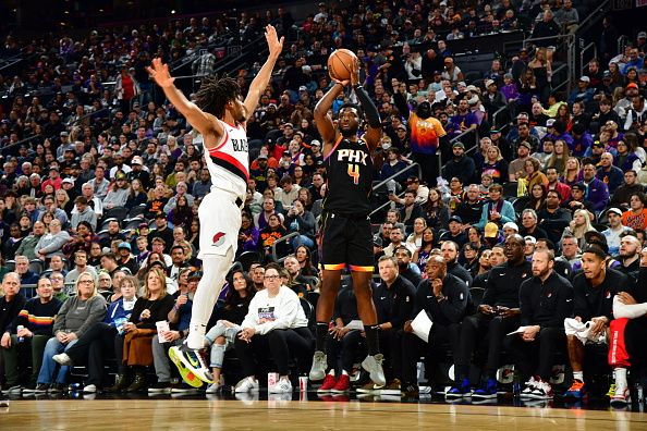 PHOENIX, AZ - JANUARY  1: Chimezie Metu #4 of the Phoenix Suns shoots the ball during the game against the Portland Trail Blazers on January 1, 2024 at Footprint Center in Phoenix, Arizona. NOTE TO USER: User expressly acknowledges and agrees that, by downloading and or using this photograph, user is consenting to the terms and conditions of the Getty Images License Agreement. Mandatory Copyright Notice: Copyright 2024 NBAE (Photo by Kate Frese/NBAE via Getty Images)