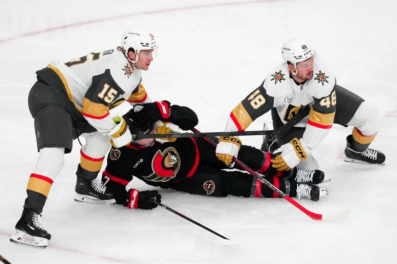 Oct 25, 2024; Las Vegas, Nevada, USA; Vegas Golden Knights defenseman Noah Hanifin (15) and Vegas Golden Knights center Tomas Hertl (48) defend against Ottawa Senators left wing Brady Tkachuk (7) during the third period at T-Mobile Arena. Mandatory Credit: Stephen R. Sylvanie-Imagn Images