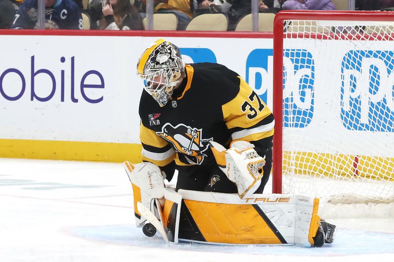 Dec 13, 2025; Pittsburgh, Pennsylvania, USA;  Pittsburgh Penguins goaltender Arturs Silovs (37) makes a save against the San Jose Sharks during the second period at PPG Paints Arena. Mandatory Credit: Charles LeClaire-Imagn Images