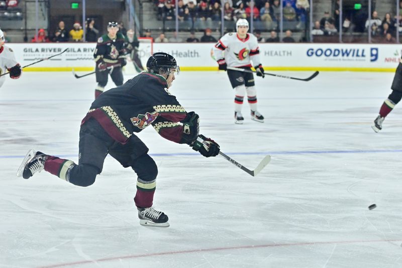 Dec 19, 2023; Tempe, Arizona, USA; Arizona Coyotes right wing Clayton Keller (9) shoots the puck in the second period against the Ottawa Senators at Mullett Arena. Mandatory Credit: Matt Kartozian-USA TODAY Sports