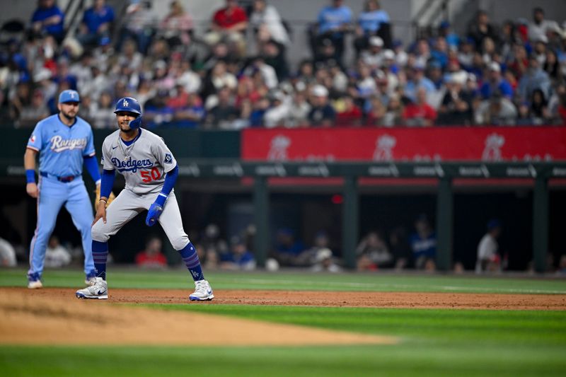 Apr 20, 2025; Arlington, Texas, USA; Los Angeles Dodgers shortstop Mookie Betts (50) looks on from the baseline during the third inning against the Texas Rangers at Globe Life Field. Mandatory Credit: Jerome Miron-Imagn Images