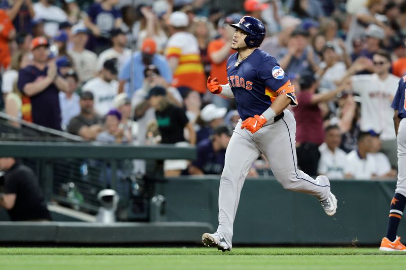 Jul 20, 2024; Seattle, Washington, USA; Houston Astros catcher Yainer Diaz (21) celebrates after hitting a solo home run against the Seattle Mariners during the eighth inning at T-Mobile Park. Mandatory Credit: John Froschauer-USA TODAY Sports