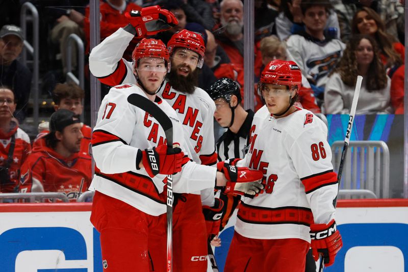 Jan 5, 2024; Washington, District of Columbia, USA; Carolina Hurricanes defenseman Brent Burns (8) celebrates with teammates after scoring a goal against the Washington Capitals in the second period at Capital One Arena. Mandatory Credit: Geoff Burke-USA TODAY Sports