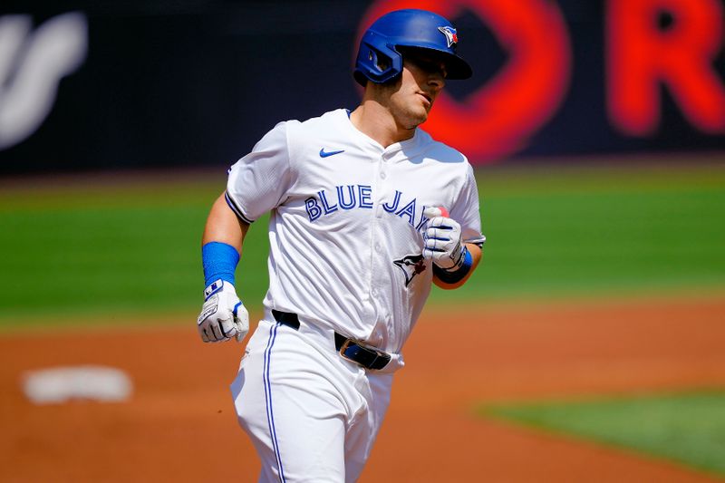 Jul 28, 2024; Toronto, Ontario, CAN; Toronto Blue Jays left fielder Daulton Varsho (25) heads for home on his two run home run against the Texas Rangers during the first inning at Rogers Centre. Mandatory Credit: John E. Sokolowski-USA TODAY Sports