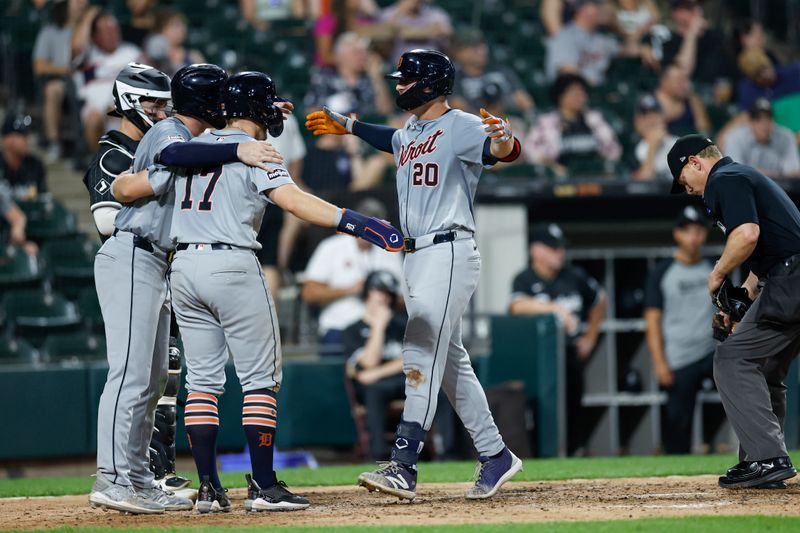 Aug 26, 2024; Chicago, Illinois, USA; Detroit Tigers first baseman Spencer Torkelson (20) celebrates with second baseman Jace Jung (17) and second baseman Colt Keith (33) after hitting a three-run home run against the Chicago White Sox during the seventh inning at Guaranteed Rate Field. Mandatory Credit: Kamil Krzaczynski-USA TODAY Sports