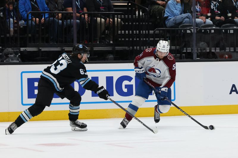 Oct 24, 2024; Salt Lake City, Utah, USA; Colorado Avalanche right wing Nikolai Kovalenko (51) skates against Utah Hockey Club left wing Matias Maccelli (63) during the first period at Delta Center. Mandatory Credit: Rob Gray-Imagn Images