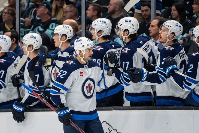 Oct 24, 2024; Seattle, Washington, USA;  Winnipeg Jets forward Nino Niederreiter (62) is congrtulated by teammates on the bench during the third period against the Seattle Kraken  Climate Pledge Arena. Mandatory Credit: Stephen Brashear-Imagn Images