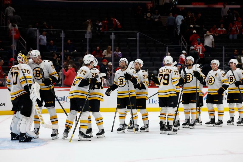 Oct 2, 2025; Washington, District of Columbia, USA; Boston Bruins goaltender Joonas Korpisalo (70) celebrates with teammates after their game against the Washington Capitals at Capital One Arena. Mandatory Credit: Geoff Burke-Imagn Images
