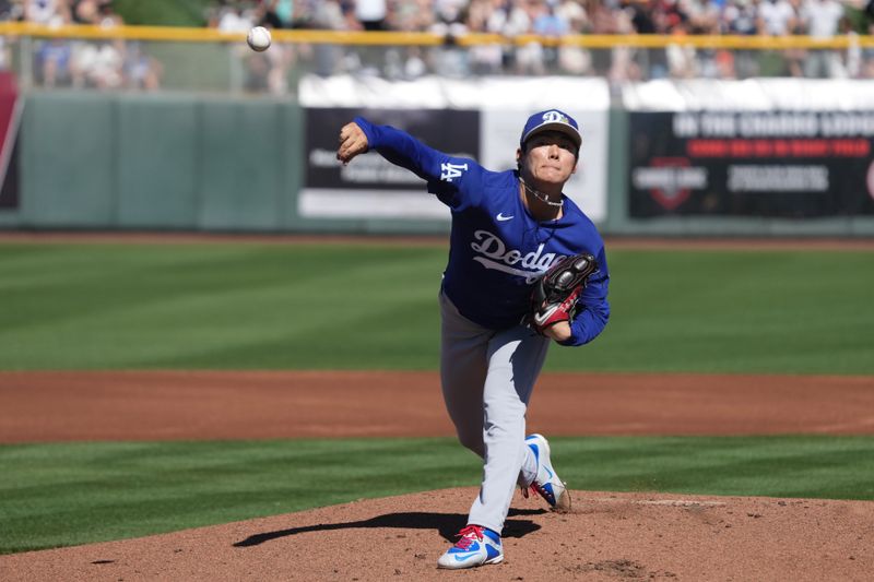 Feb 27, 2026; Scottsdale, Arizona, USA; Los Angeles Dodgers pitcher Yoshinobu Yamamoto (18) throws against the San Francisco Giants in the first inning at Scottsdale Stadium. Mandatory Credit: Rick Scuteri-Imagn Images