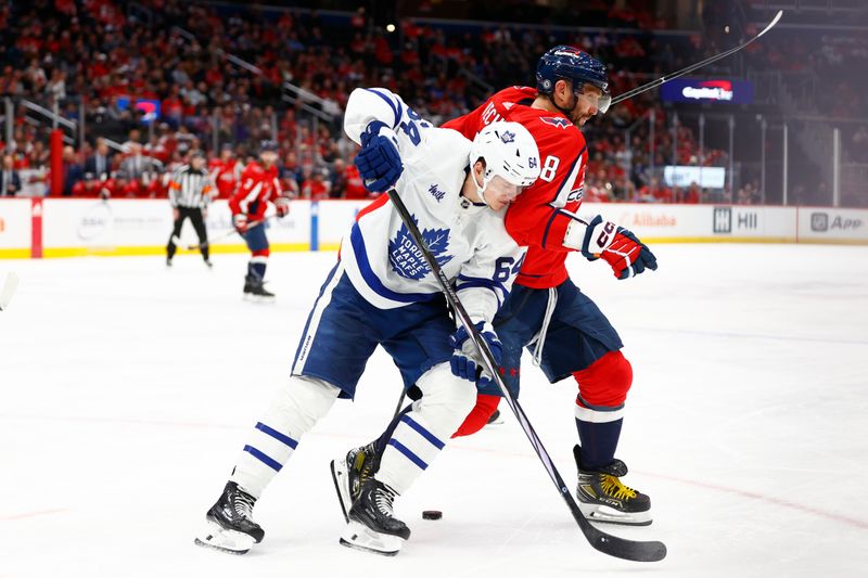 Mar 20, 2024; Washington, District of Columbia, USA; Washington Capitals left wing Alex Ovechkin (8) battles for the puck with Toronto Maple Leafs center David Kampf (64) during the third period at Capital One Arena. Mandatory Credit: Amber Searls-USA TODAY Sports