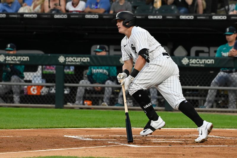 Aug 22, 2023; Chicago, Illinois, USA; Chicago White Sox first baseman Andrew Vaughn (25) hits an RBI single against the Seattle Mariners during the first inning at Guaranteed Rate Field. Mandatory Credit: Matt Marton-USA TODAY Sports