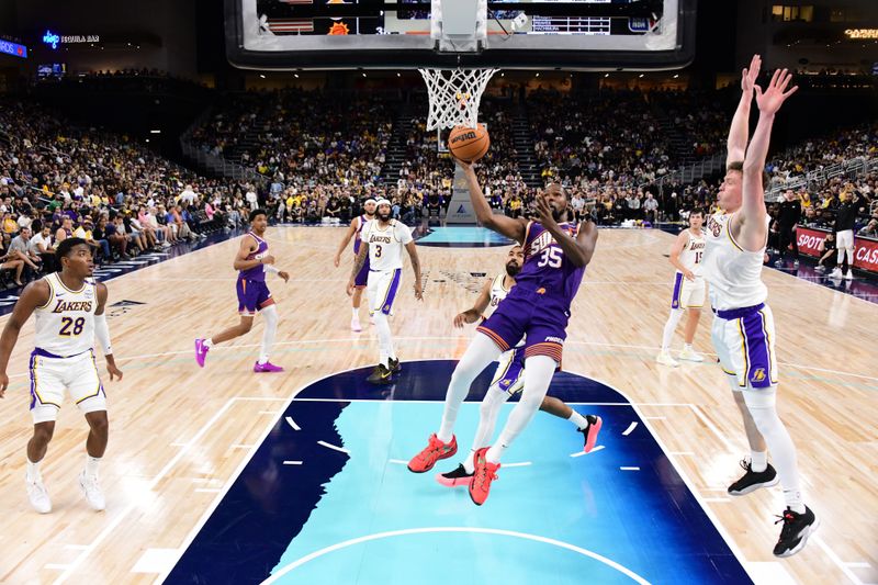 LOS ANGELES, CA - OCTOBER 6: Kevin Durant #35 of the Phoenix Suns drives to the basket during the game against the Los Angeles Lakers on October 6, 2024 at Acrisure Arena in Palm Springs, California. NOTE TO USER: User expressly acknowledges and agrees that, by downloading and/or using this Photograph, user is consenting to the terms and conditions of the Getty Images License Agreement. Mandatory Copyright Notice: Copyright 2024 NBAE (Photo by Adam Pantozzi/NBAE via Getty Images)