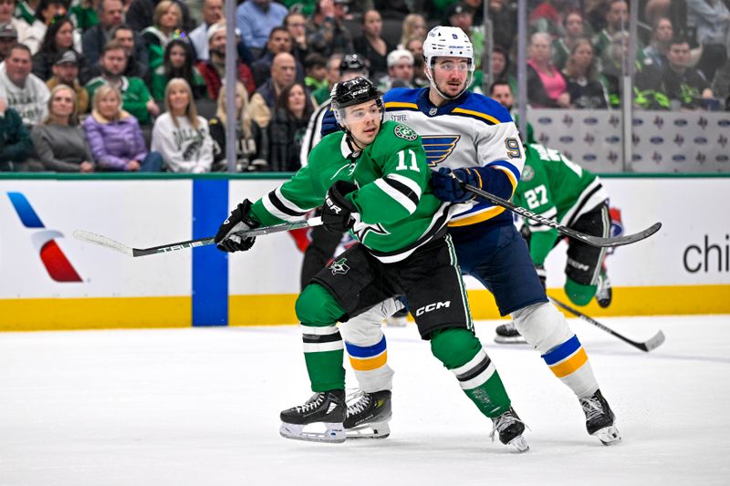 Dec 14, 2024; Dallas, Texas, USA; St. Louis Blues center Alexandre Texier (9) and Dallas Stars center Logan Stankoven (11) look for the puck in the Blues zone during the second period at American Airlines Center. Mandatory Credit: Jerome Miron-Imagn Images