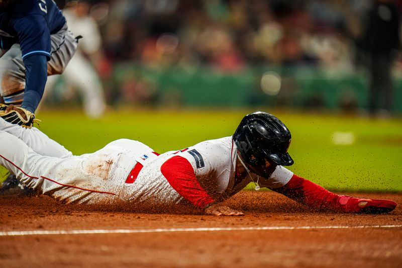 Sep 26, 2023; Boston, Massachusetts, USA; Boston Red Sox second baseman Enmanuel Valdez (47) tagged out at third base by Tampa Bay Rays third baseman Junior Caminero (1) in the third inning at Fenway Park. Mandatory Credit: David Butler II-USA TODAY Sports