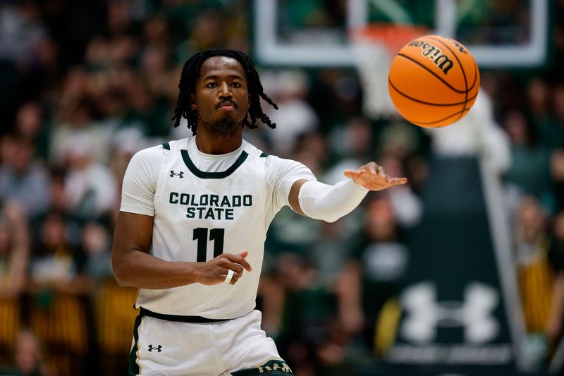 Feb 15, 2025; Fort Collins, Colorado, USA; Colorado State Rams guard Keshawn Williams (11) passes the ball in the second half against the Wyoming Cowboys at Moby Arena. Mandatory Credit: Isaiah J. Downing-Imagn Images