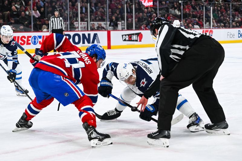 Jan 28, 2025; Montreal, Quebec, CAN; NHL linesman Ryan Daisy (81) drops the puck at a face-off between Montreal Canadiens center Jake Evans (71) and Winnipeg Jets center Vladislav Namestnikov (7) during the first period at Bell Centre. Mandatory Credit: David Kirouac-Imagn Images