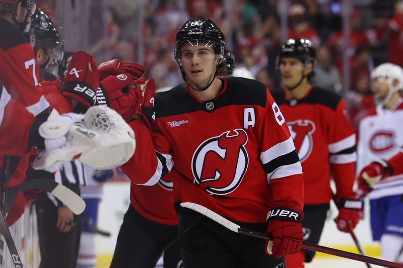 Nov 7, 2024; Newark, New Jersey, USA; New Jersey Devils center Jack Hughes (86) celebrates his goal against the Montreal Canadiens during the third period at Prudential Center. Mandatory Credit: Ed Mulholland-Imagn Images