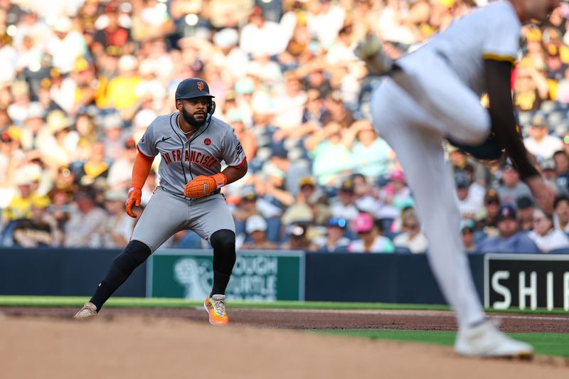 Sep 7, 2024; San Diego, California, USA; San Francisco Giants center fielder Heliot Ramos (17) leads off after a single against the San Diego Padres in the first inning at Petco Park. Mandatory Credit: Chadd Cady-Imagn Images