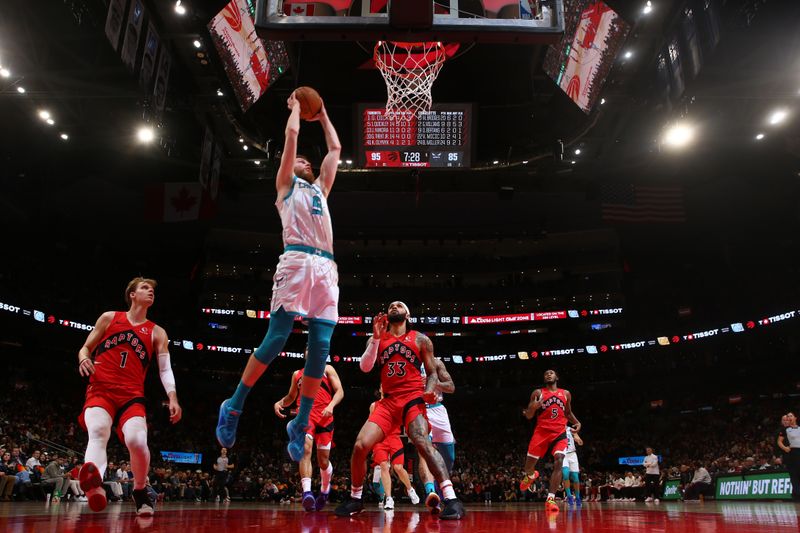 TORONTO, CANADA - MARCH 3: Davis Bertans #9 of the Charlotte Hornets  drives to the basket during the game against the Toronto Raptors on March 3, 2024 at the Scotiabank Arena in Toronto, Ontario, Canada.  NOTE TO USER: User expressly acknowledges and agrees that, by downloading and or using this Photograph, user is consenting to the terms and conditions of the Getty Images License Agreement.  Mandatory Copyright Notice: Copyright 2024 NBAE (Photo by Vaughn Ridley/NBAE via Getty Images)