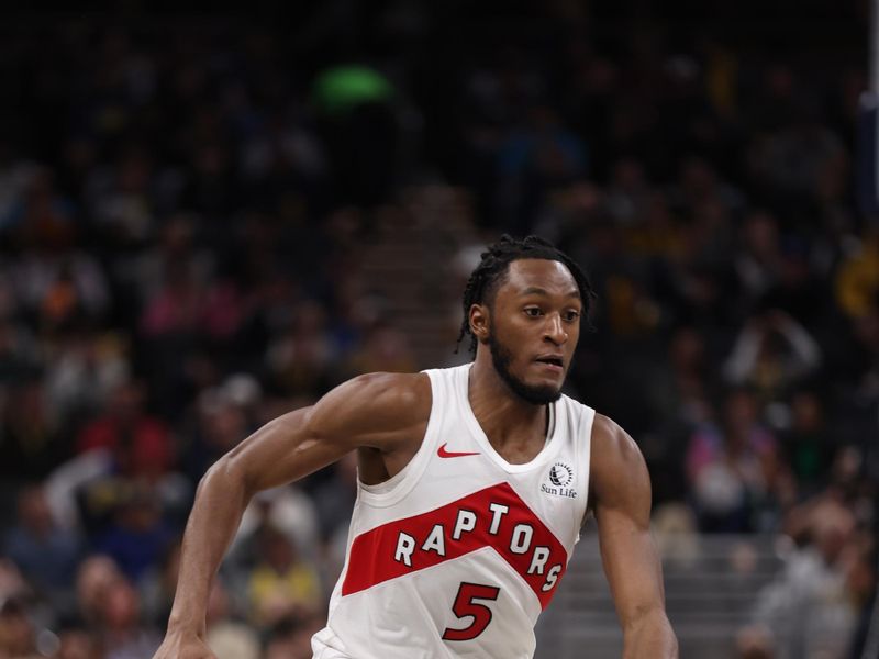 INDIANAPOLIS, IN - FEBRUARY 27: Immanuel Quickley #5 of the Toronto Raptors dribbles the ball during the gameagainst the Indiana Pacers on February 27, 2024 at Gainbridge Fieldhouse in Indianapolis, Indiana. NOTE TO USER: User expressly acknowledges and agrees that, by downloading and or using this Photograph, user is consenting to the terms and conditions of the Getty Images License Agreement. Mandatory Copyright Notice: Copyright 2024 NBAE (Photo by Pepper Robinson/NBAE via Getty Images)