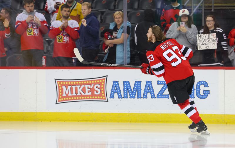 Oct 22, 2024; Newark, New Jersey, USA; New Jersey Devils defenseman Daniil Misyul (93) skates his rookie lap before making his NHL debut against the Tampa Bay Lightning at Prudential Center. Mandatory Credit: Ed Mulholland-Imagn Images