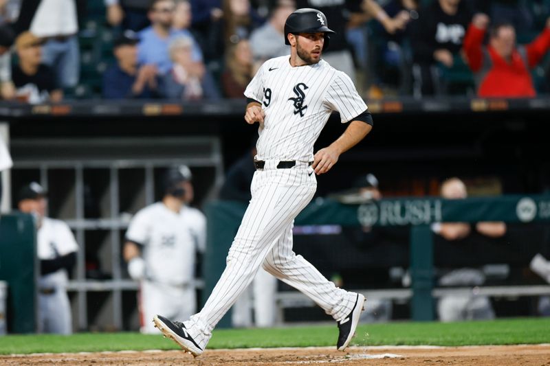 Apr 30, 2024; Chicago, Illinois, USA; Chicago White Sox shortstop Paul DeJong (29) scores against the Minnesota Twins during the fourth inning at Guaranteed Rate Field. Mandatory Credit: Kamil Krzaczynski-USA TODAY Sports
