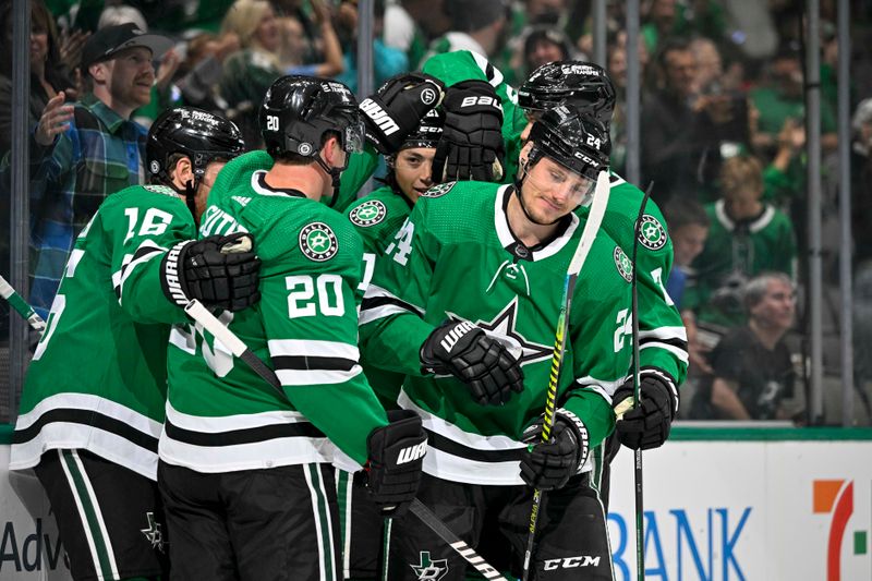 Oct 15, 2022; Dallas, Texas, USA; Dallas Stars center Joe Pavelski (16) and center Roope Hintz (24) and left wing Jason Robertson (21) and defenseman Ryan Suter (20) celebrates a goal scored by Hintz against the Nashville Predators during the second period at the American Airlines Center. Mandatory Credit: Jerome Miron-USA TODAY Sports