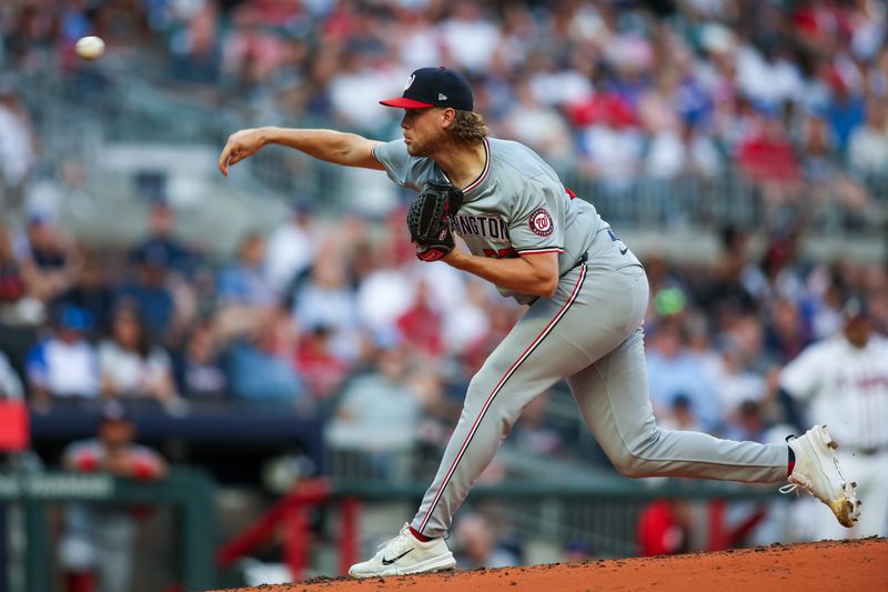 May 28, 2024; Atlanta, Georgia, USA; Washington Nationals starting pitcher Jake Irvin (27) throws against the Atlanta Braves in the second inning at Truist Park. Mandatory Credit: Brett Davis-USA TODAY Sports