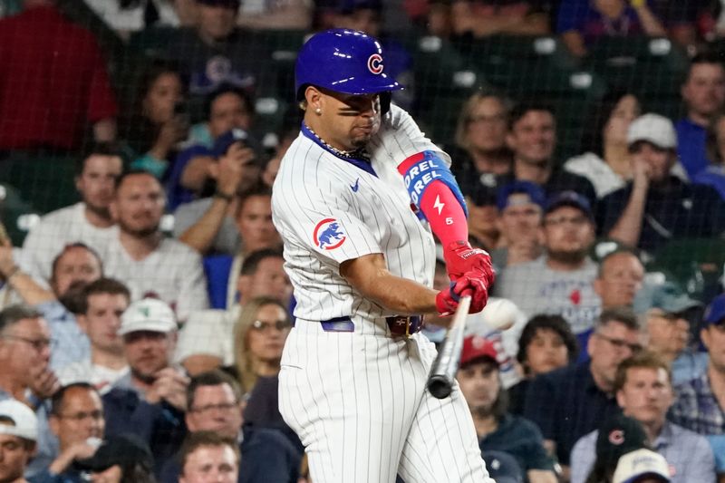 Jun 4, 2024; Chicago, Illinois, USA; Chicago Cubs third base Christopher Morel (5) hits a two-run home run against the Chicago White Sox during the sixth inning at Wrigley Field. Mandatory Credit: David Banks-USA TODAY Sports