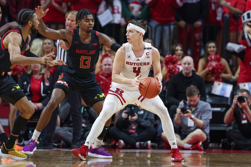 Jan 5, 2023; Piscataway, New Jersey, USA; Rutgers Scarlet Knights guard Paul Mulcahy (4) dribbles as Maryland Terrapins guard Hakim Hart (13) defends during the first half at Jersey Mike's Arena. Mandatory Credit: Vincent Carchietta-USA TODAY Sports