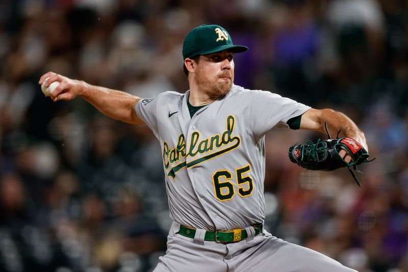 Jul 28, 2023; Denver, Colorado, USA; Oakland Athletics relief pitcher Trevor May (65) pitches in the ninth inning against the Colorado Rockies at Coors Field. Mandatory Credit: Isaiah J. Downing-USA TODAY Sports