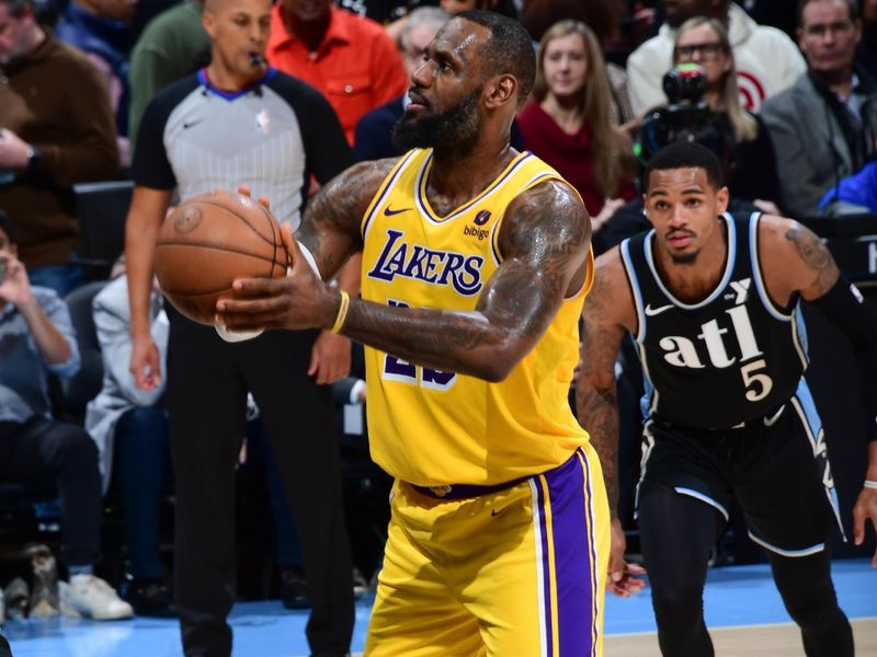 ATLANTA, GA - JANUARY 30: LeBron James #23 of the Los Angeles Lakers shoots a free throw during the game on January 30, 2024 at State Farm Arena in Atlanta, Georgia.  NOTE TO USER: User expressly acknowledges and agrees that, by downloading and/or using this Photograph, user is consenting to the terms and conditions of the Getty Images License Agreement. Mandatory Copyright Notice: Copyright 2024 NBAE (Photo by Scott Cunningham/NBAE via Getty Images)