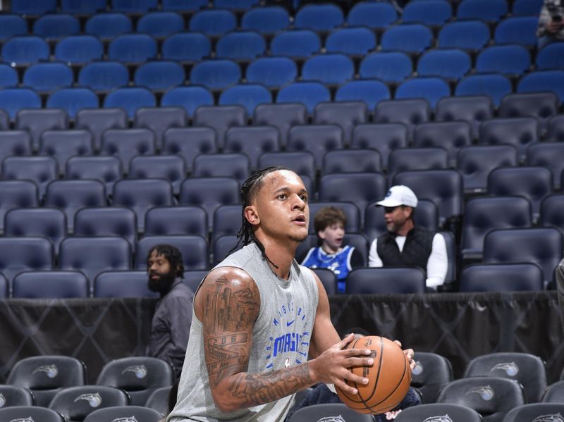 ORLANDO, FL - JANUARY 9: Paolo Banchero #5 of the Orlando Magic warms up before the game against the Minnesota Timberwolves on January 9, 2025 at Kia Center in Orlando, Florida. NOTE TO USER: User expressly acknowledges and agrees that, by downloading and or using this photograph, User is consenting to the terms and conditions of the Getty Images License Agreement. Mandatory Copyright Notice: Copyright 2025 NBAE (Photo by Gary Bassing/NBAE via Getty Images)