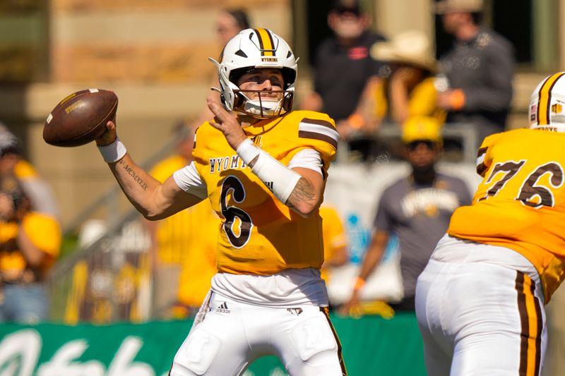 Sep 3, 2022; Laramie, Wyoming, USA; Wyoming Cowboys quarterback Andrew Peasley (6) throws against the Tulsa Golden Hurricane during the second quarter at Jonah Field at War Memorial Stadium. Mandatory Credit: Troy Babbitt-USA TODAY Sports