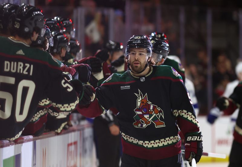 Nov 28, 2023; Tempe, Arizona, USA; Arizona Coyotes left wing Michael Carcone (53) celebrates a goal with teammates against the Tampa Bay Lightning in the first period at Mullett Arena. Mandatory Credit: Mark J. Rebilas-USA TODAY Sports