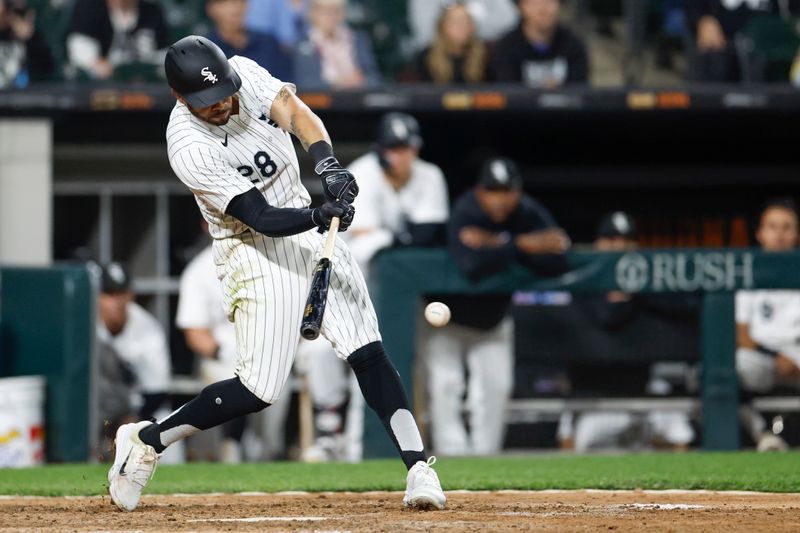 Apr 30, 2024; Chicago, Illinois, USA; Chicago White Sox outfielder Tommy Pham (28) singles against the Minnesota Twins during the ninth inning at Guaranteed Rate Field. Mandatory Credit: Kamil Krzaczynski-USA TODAY Sports