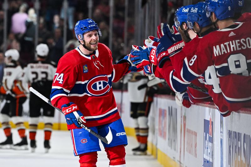 Feb 13, 2024; Montreal, Quebec, CAN; Montreal Canadiens center Brandon Gignac (74) celebrates his first NHL goal against the Anaheim Ducks with his teammates at the bench during the third period at Bell Centre. Mandatory Credit: David Kirouac-USA TODAY Sports