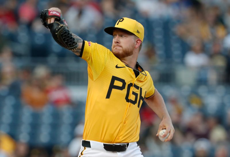 Aug 23, 2024; Pittsburgh, Pennsylvania, USA;  Pittsburgh Pirates starting pitcher Bailey Falter (26) delivers a pitch against the Cincinnati Reds during the first inning at PNC Park. Mandatory Credit: Charles LeClaire-USA TODAY Sports