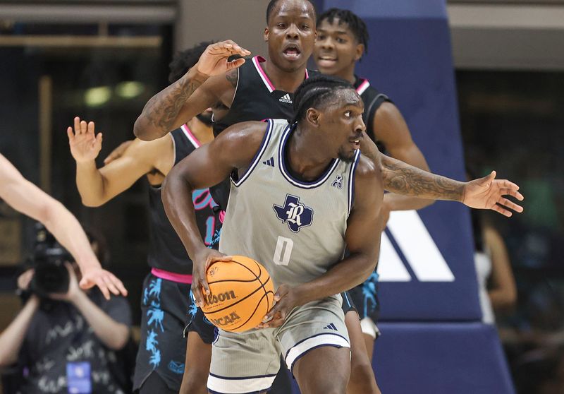 Jan 24, 2024; Houston, Texas, USA; Rice Owls forward Sam Alajiki (0) controls the ball during the second half against the Florida Atlantic Owls at Tudor Fieldhouse. Mandatory Credit: Troy Taormina-USA TODAY Sports