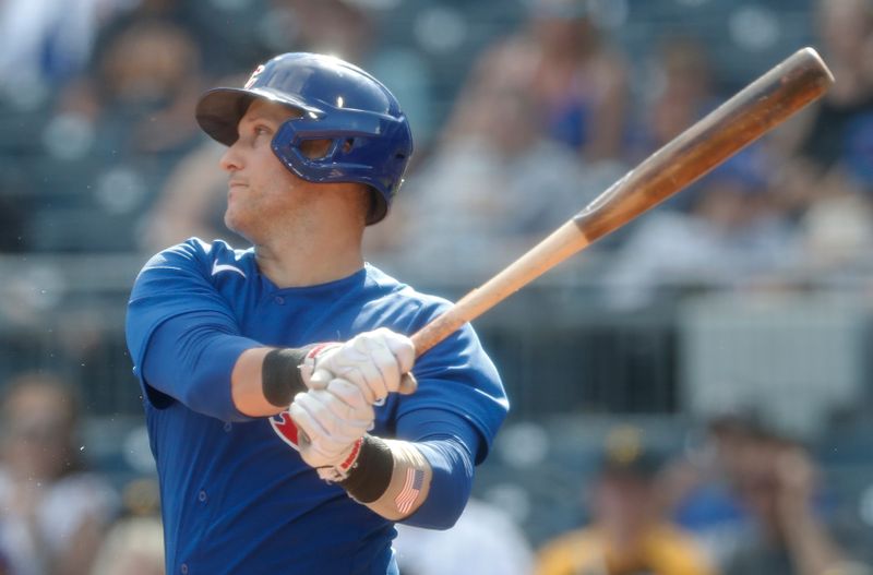 Aug 27, 2023; Pittsburgh, Pennsylvania, USA;  Chicago Cubs catcher Yan Gomes (15) drives in a run on a fielders choice out against the Pittsburgh Pirates during the ninth inning at PNC Park. Chicago won 10-1. Mandatory Credit: Charles LeClaire-USA TODAY Sports