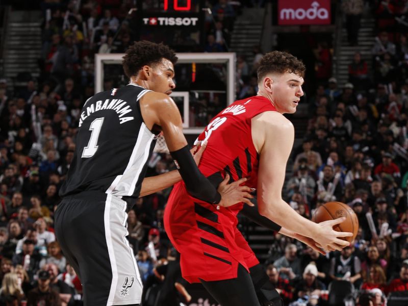 PORTLAND, OR - DECEMBER 13: Donovan Clingan #23 of the Portland Trail Blazers handles the ball during the game against the San Antonio Spurs on December 13, 2024 at the Moda Center Arena in Portland, Oregon. NOTE TO USER: User expressly acknowledges and agrees that, by downloading and or using this photograph, user is consenting to the terms and conditions of the Getty Images License Agreement. Mandatory Copyright Notice: Copyright 2024 NBAE (Photo by Cameron Browne/NBAE via Getty Images)