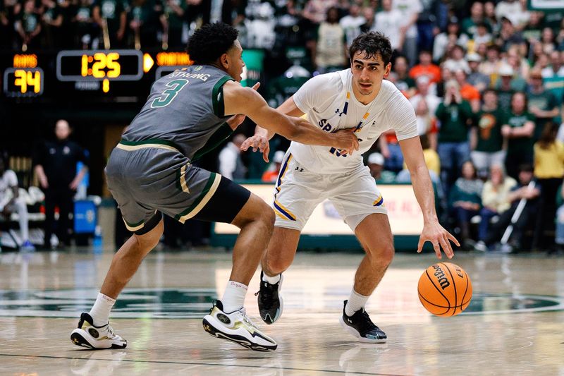 Feb 9, 2024; Fort Collins, Colorado, USA; San Jose State Spartans guard Alvaro Cardenas (13) controls the ball as Colorado State Rams guard Josiah Strong (3) guards in the first half at Moby Arena. Mandatory Credit: Isaiah J. Downing-USA TODAY Sports