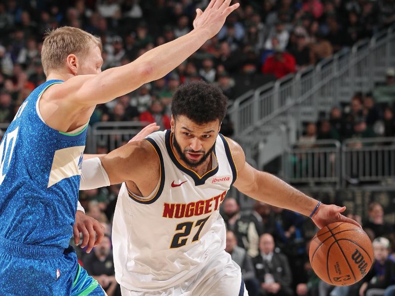 MILWAUKEE, WI - FEBRUARY 12: Jamal Murray #27 of the Denver Nuggets handles the ball during the game against the Milwaukee Bucks on February 12, 2024 at the Fiserv Forum Center in Milwaukee, Wisconsin. NOTE TO USER: User expressly acknowledges and agrees that, by downloading and or using this Photograph, user is consenting to the terms and conditions of the Getty Images License Agreement. Mandatory Copyright Notice: Copyright 2024 NBAE (Photo by Gary Dineen/NBAE via Getty Images).